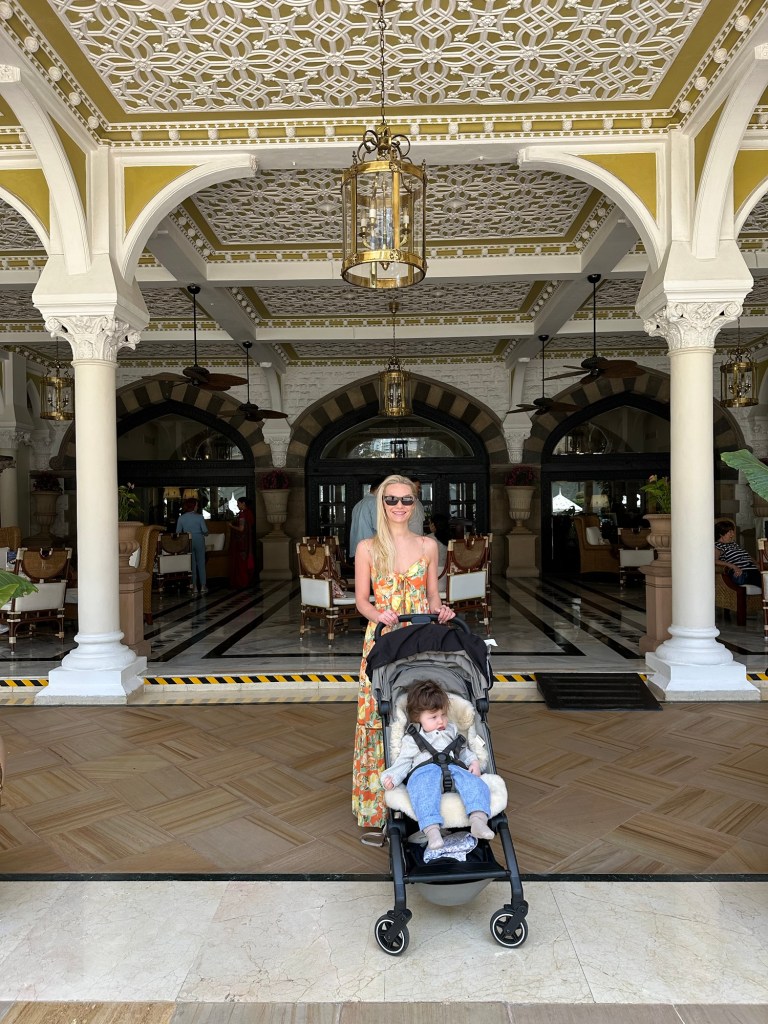 Compact foldable stroller on holiday with baby 